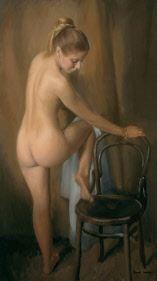 Nude drying her knee