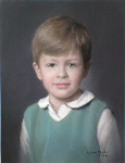 A little boy with a green top